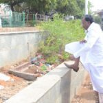 காமராஜர் சாலை சீரமைப்புக்குப் போராட்டம்